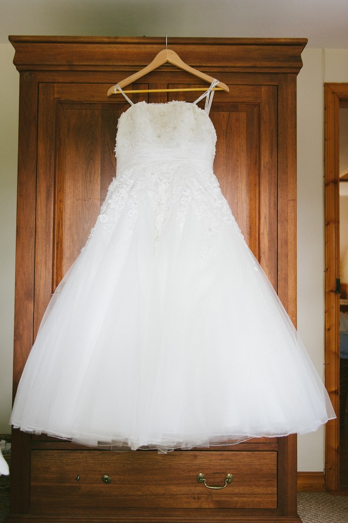 tea length wedding dress hanging up